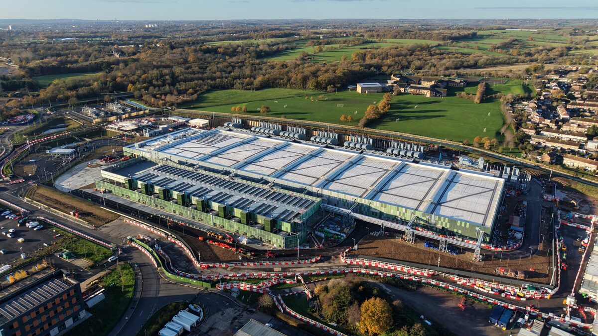 Aerial view of a large data center facility with cooling systems