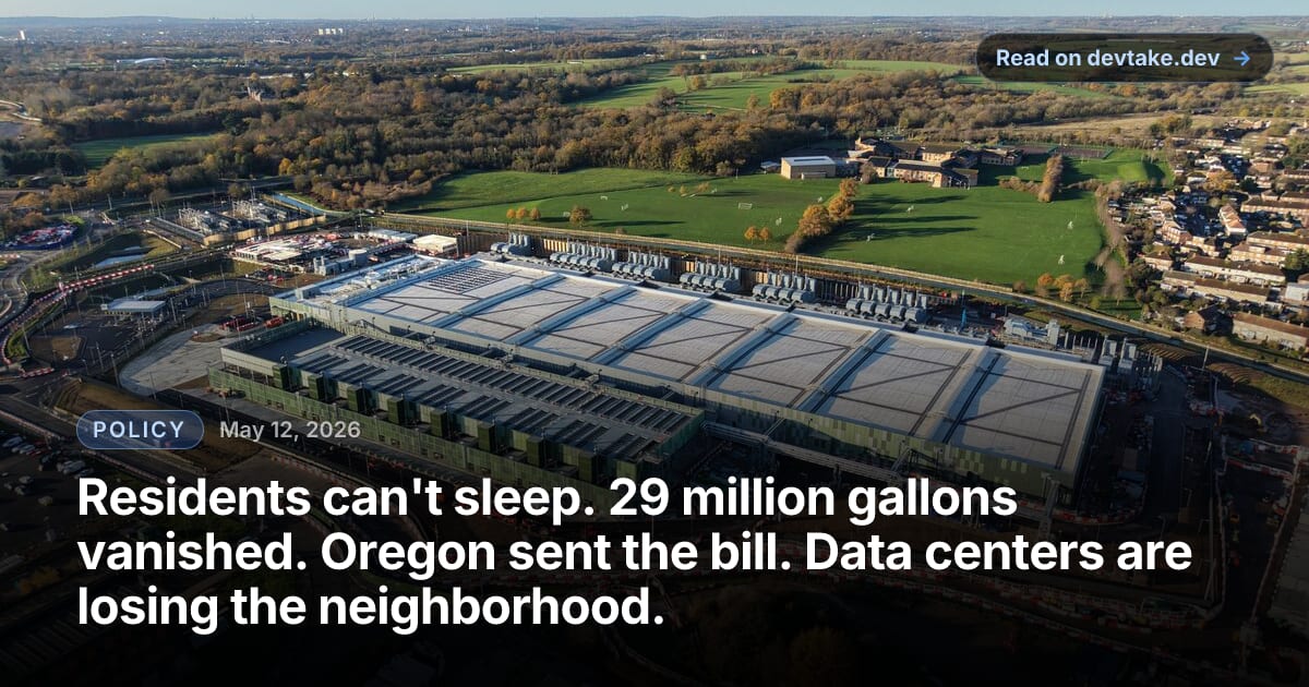 Aerial view of a large data center facility with cooling systems